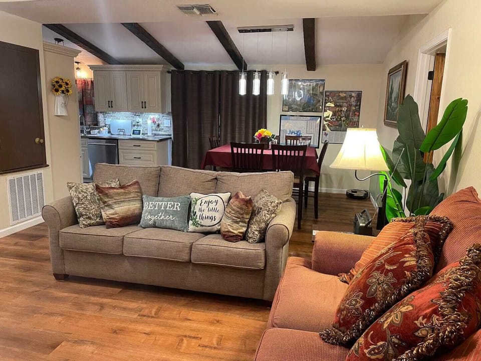 Den, table and kitchen