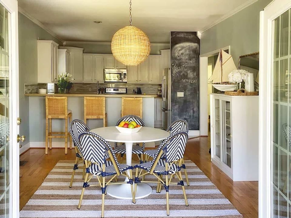 Seaside-inspired dining space blending modern elegance and coastal comfort.