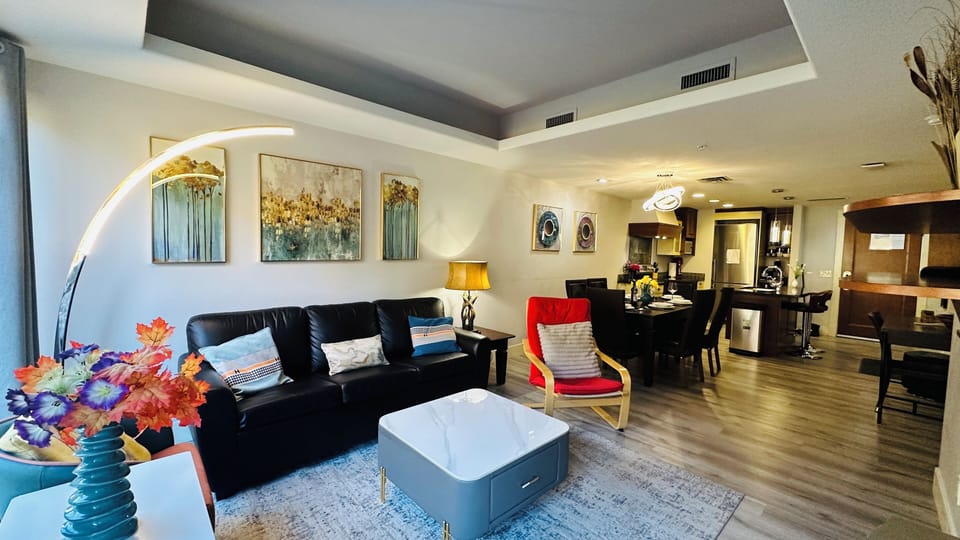 Feature a comfortable sofa, flat-screen TV, and a cozy fireplace