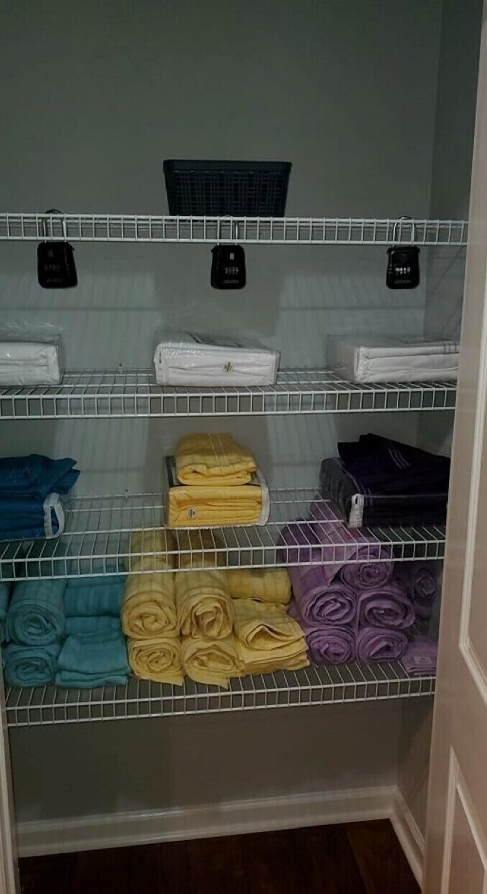 Linen closet equipped with additional make-up towels, sheets, and bath towels.