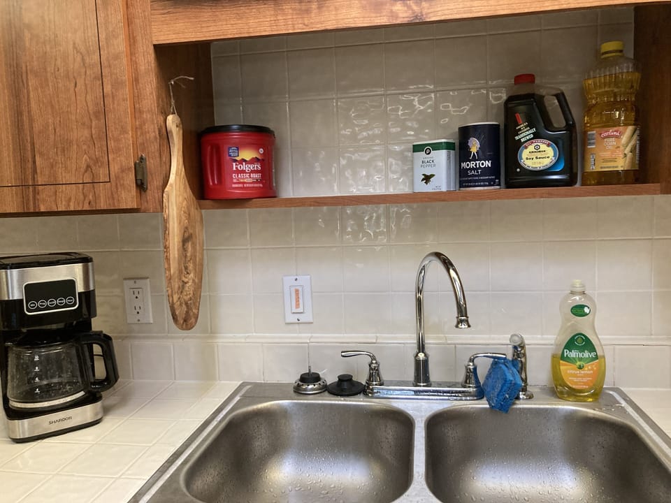 Coffee machine, coffee, tea, salt, pepper, cooking oil and soy sauce provided.
