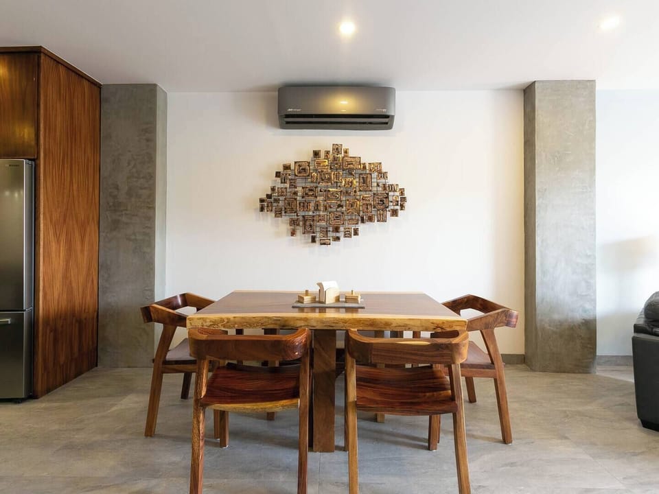 Spacious dining area with a table that comfortably seats six—perfect for shared meals and entertaining.
