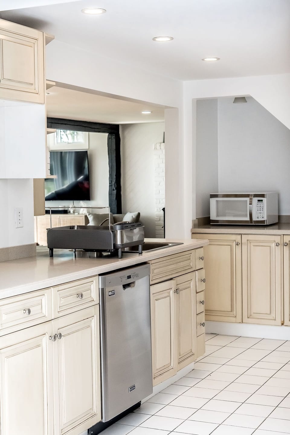 The kitchen opens up to both living spaces on the first floor. 