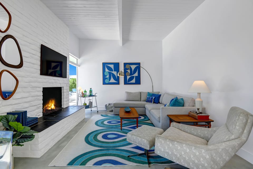 Enjoy movie night surrounding the fireplace on the comfortable sofa.