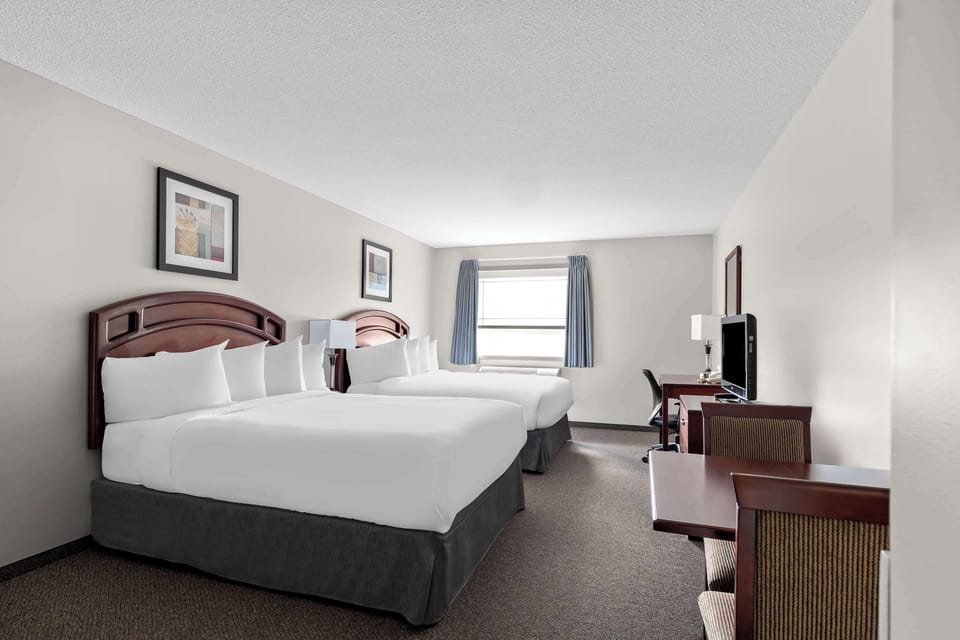 Standard Room, 2 Queen Beds, Non Smoking, Refrigerator & Microwave | Desk, laptop workspace, blackout drapes, individually furnished