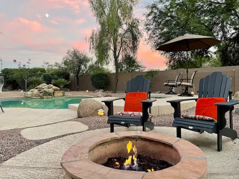 Cozy gas firepit with 4 adirondak chairs