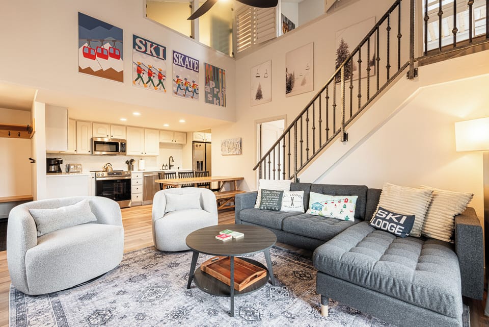 Spacious living room designed for gathering — modern décor, ample seating, and tons of natural light.