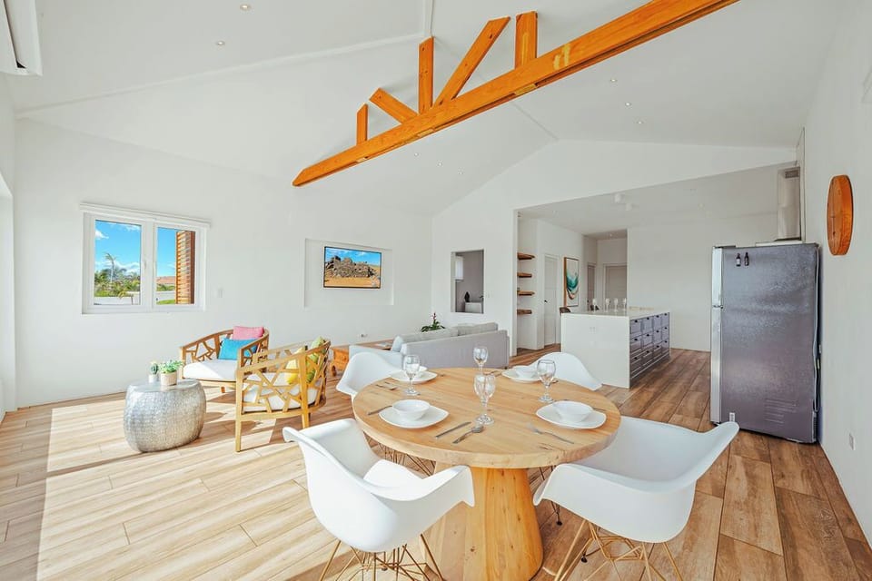 Cozy indoor dining area with natural light and serene surroundings, ideal for home-cooked meals or takeout nights