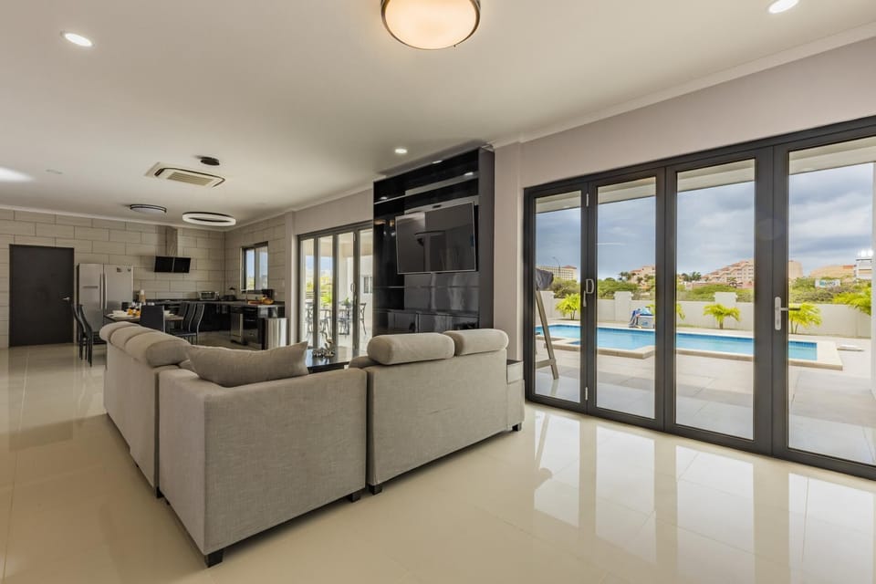 A classy living room with a large and comfy sofa.