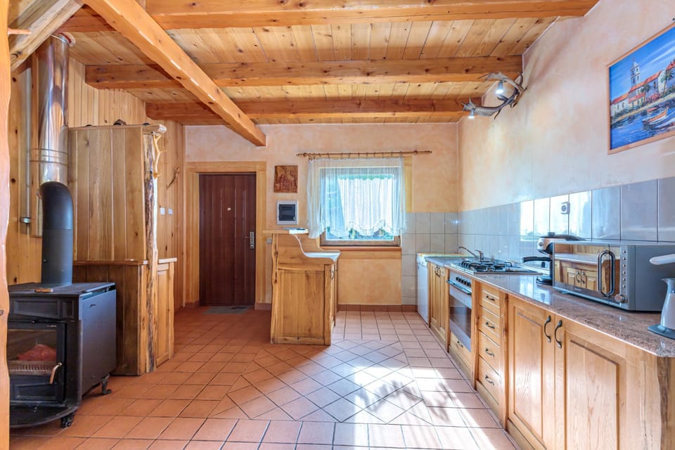 Family House, 2 Bedrooms, Balcony, Mountainside (Chalet With Private Whirlpool And) | Private kitchen | Stovetop, dining tables