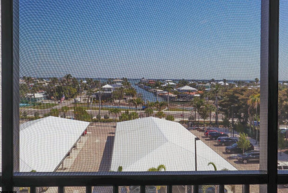 Third Screened In Lanai is off the Guest Bedroom and has a view of the Bay