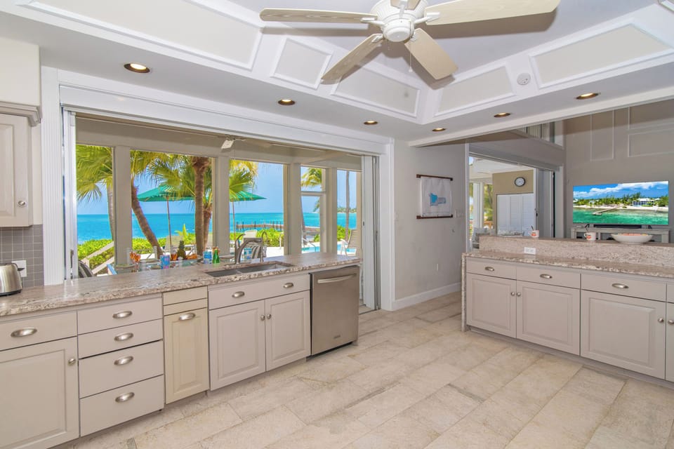 Large gourmet kitchen with Caribbean blue views.
