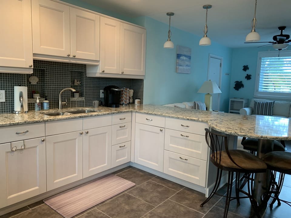 Large open kitchen with numerous amenities & extras for your stay. Fully stocked