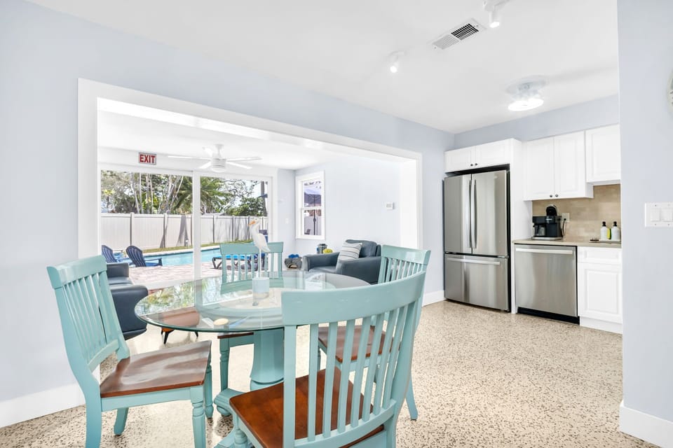 Dining Area: Bright and airy space perfect for enjoying meals with poolside views!
