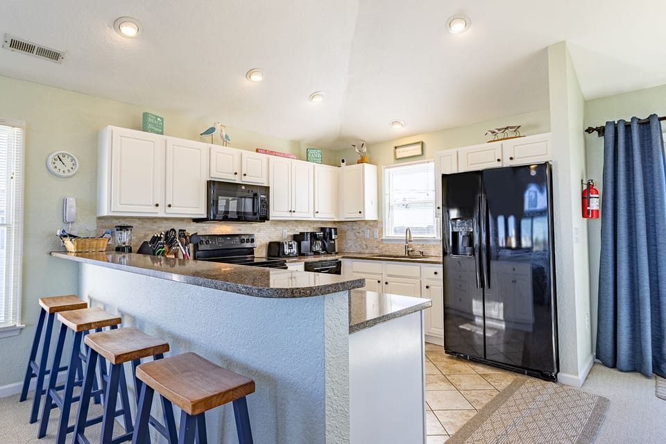 Kitchen - Bright and functional with modern finishes enjoy the open concept kitchen.