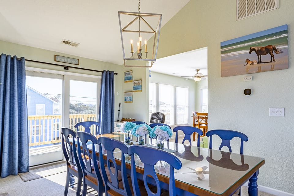 Dining Table - High ceilings and bright windows warn up this open concept dining area.