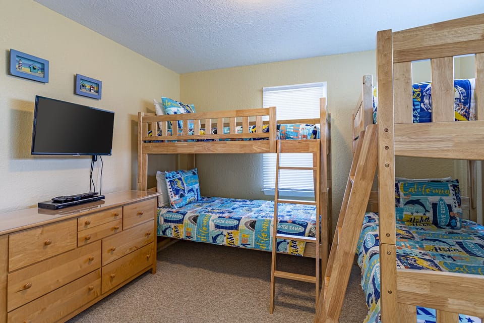 Bunk Bedroom - With room for everyone, enjoy this double bunk room equipped with a television and games for kids or adults of all ages.