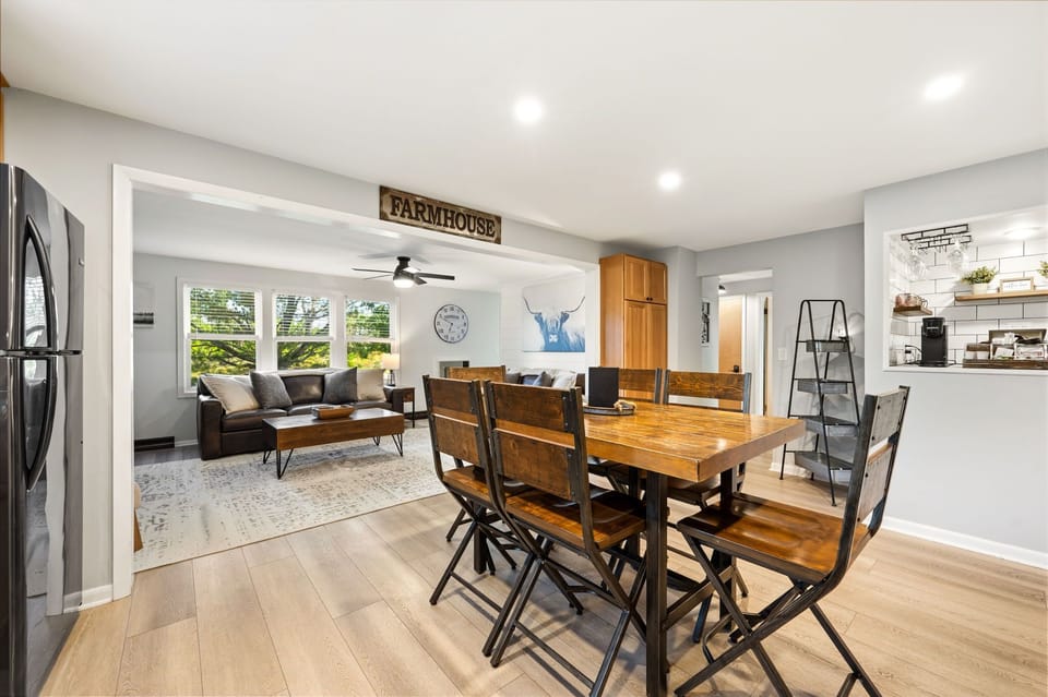 Designed for connection, open-concept dining and living area brings everyone together. Share meals around the farmhouse table, relax in the cozy living room, and enjoy the perfect blend of comfort and conversation.