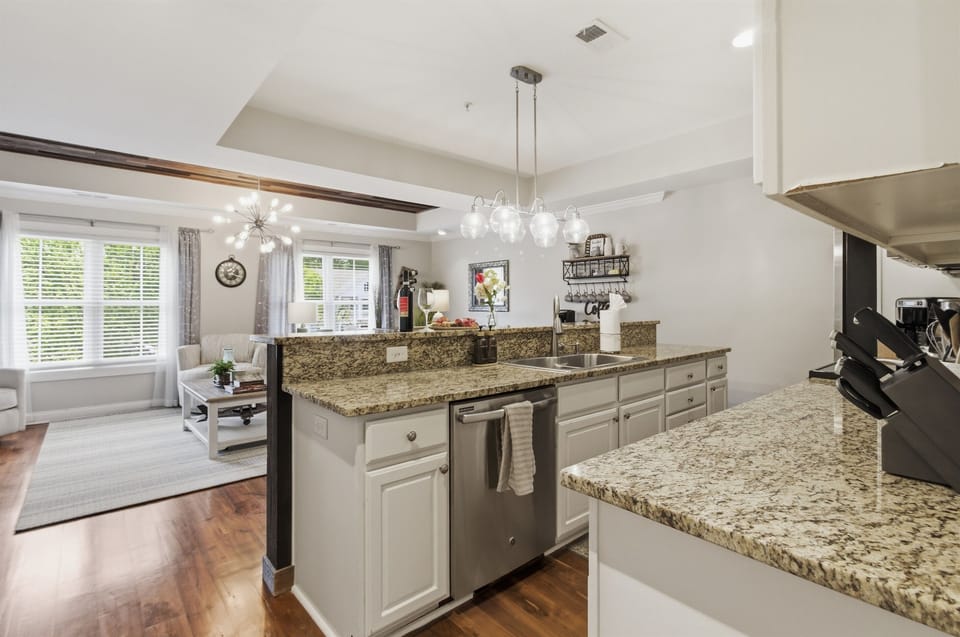Modern kitchen with an open view of the living area.
