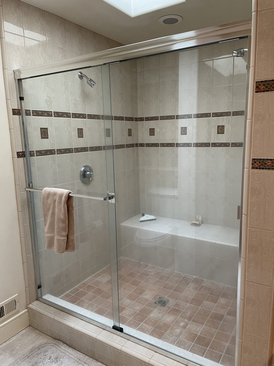 Upstairs Primary Suite bathroom walk-in shower featuring two shower heads.