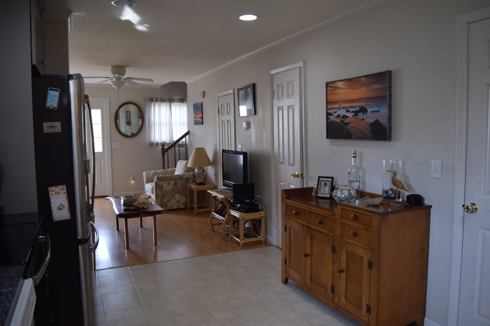 Kitchen view to livingroom with powder room door