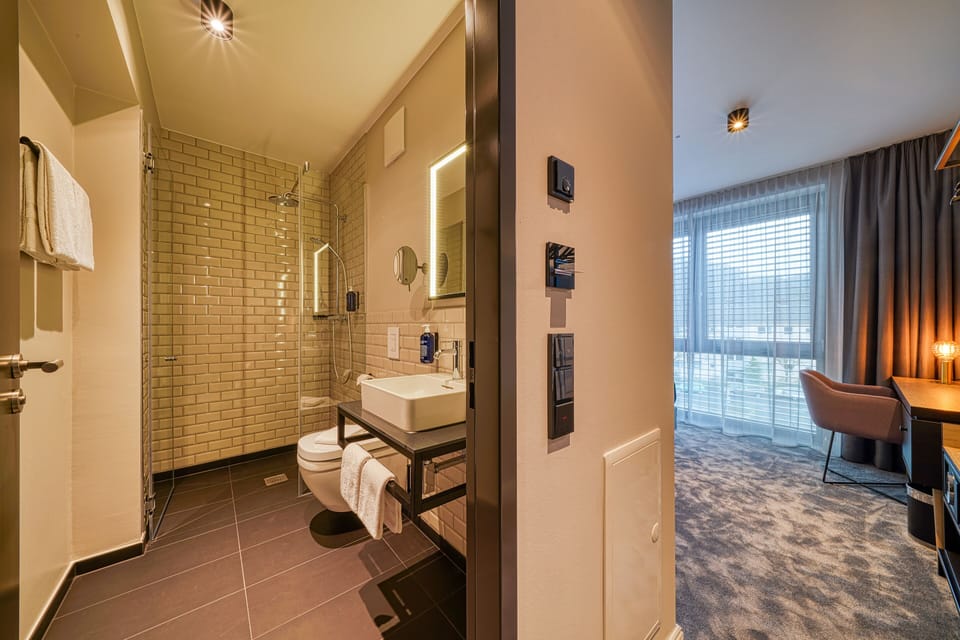 Shower, rainfall showerhead, hair dryer, towels