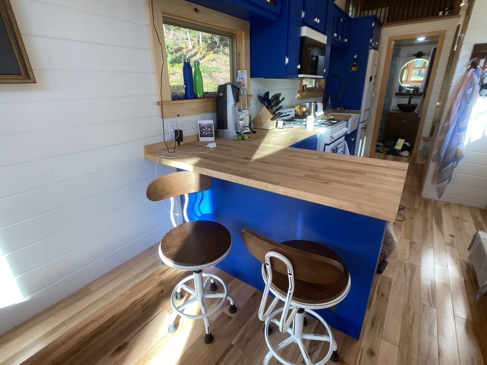 Breakfast island separates kitchen from living area.