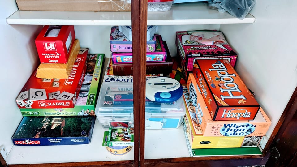 Game cabinet can be found under dining room beverage bar.