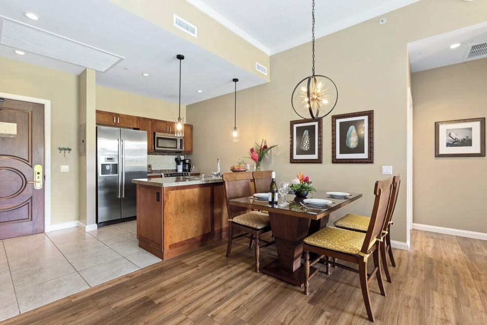 Sleek kitchen and cozy dining invite island-style meals and conversation.