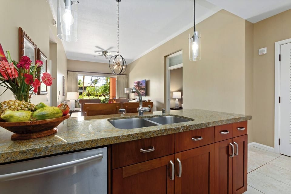 Fresh tropical flavors meet modern comfort in this island kitchen escape.