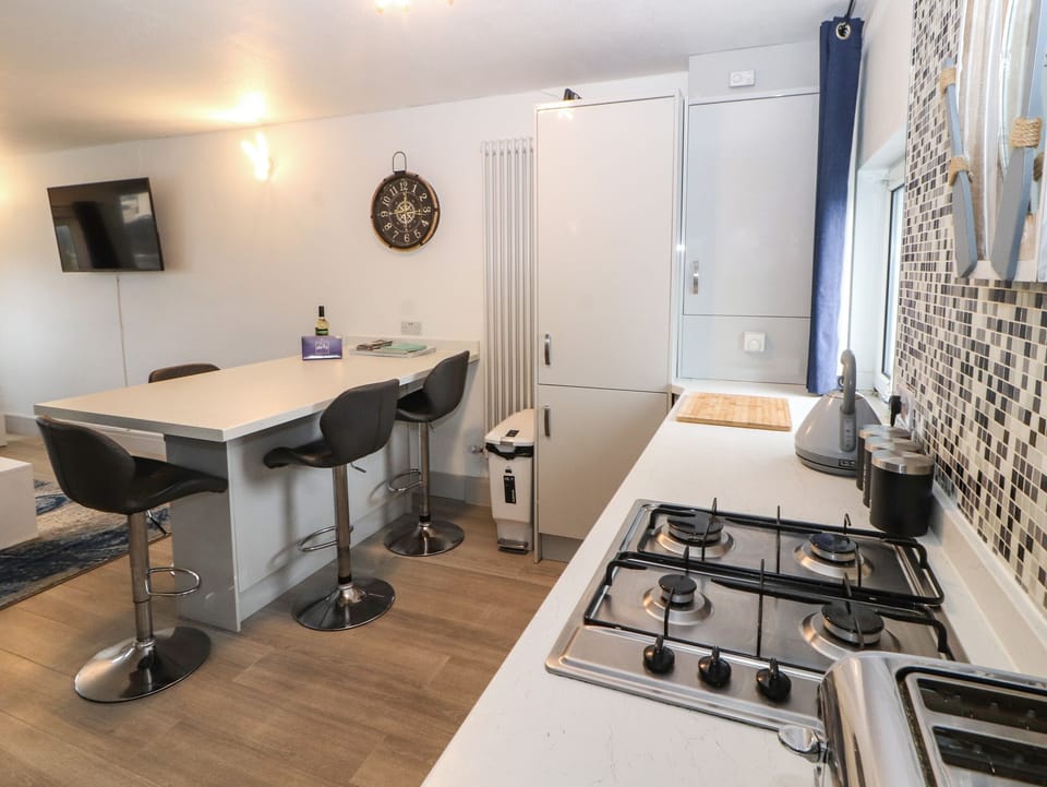 Fridge, electric kettle, toaster, cookware/dishes/utensils