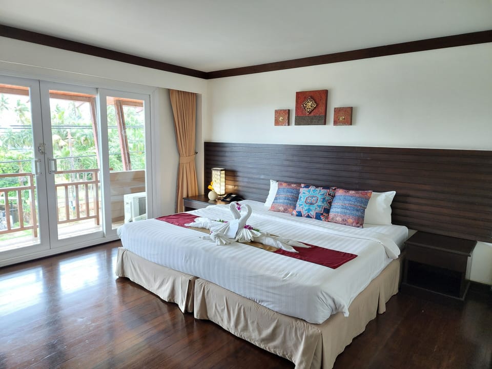 Deluxe Room, Balcony, Sea View | In-room safe, desk, blackout drapes, free cribs/infant beds
