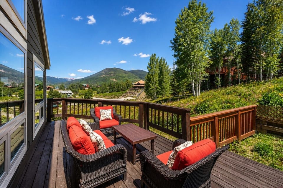 Sunny deck with comfortable seating and gorgeous mountain surroundings