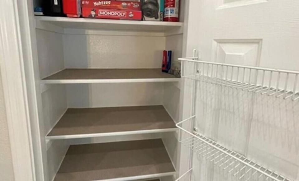 Kitchen: Pantry, games, pool float electric air pump, 1st aid kit+