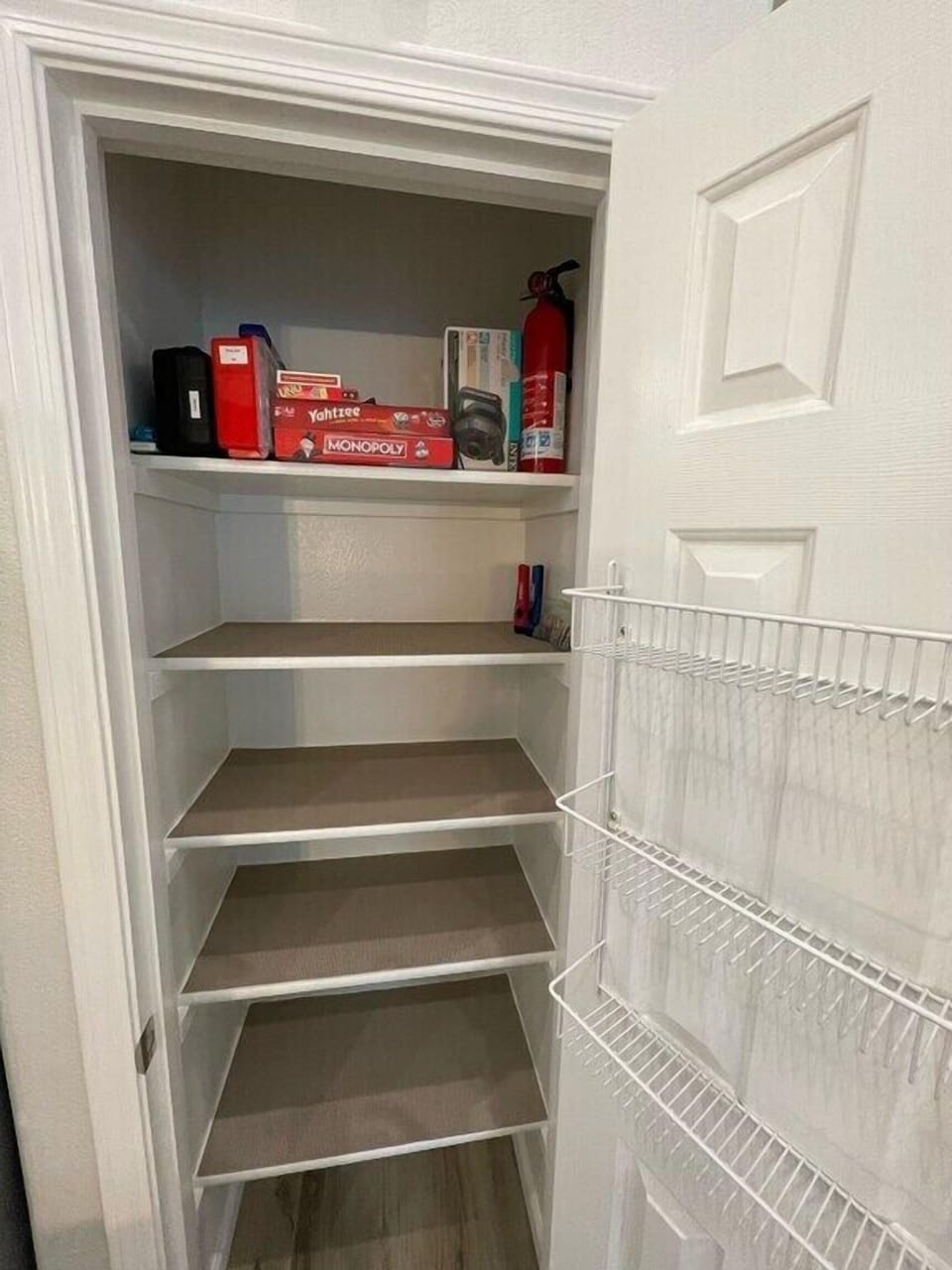 Kitchen: Pantry, games, pool float electric air pump, 1st aid kit+