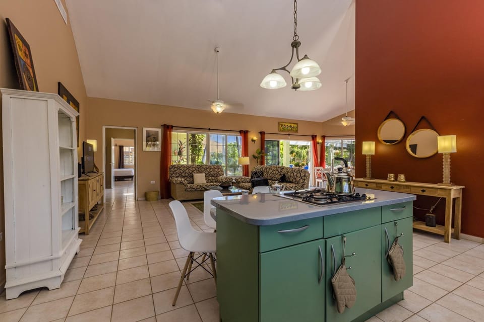 An easily accessible kitchen island with a cabinet for afternoon coffee or tea.