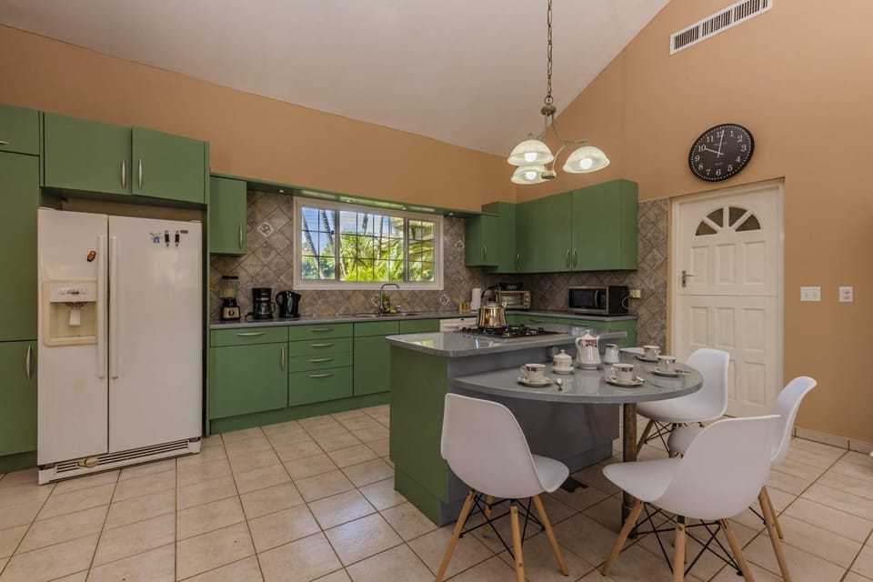 An easily accessible kitchen island with a cabinet for afternoon coffee or tea.