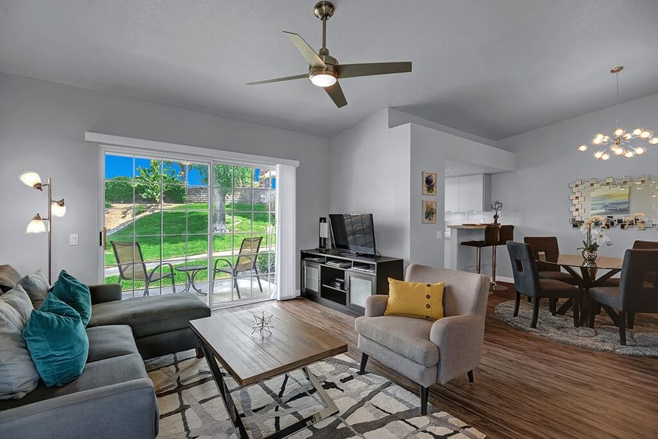 LIVING ROOM TO DINING ROOM - Oranj Palm Vacation Homes.jpg