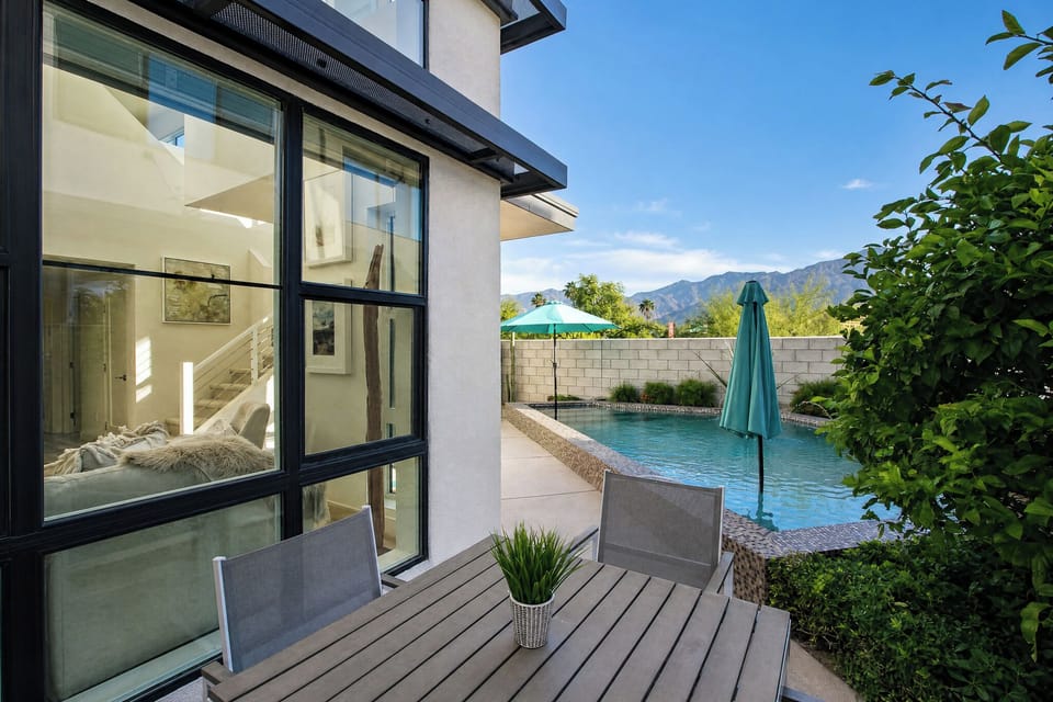 Unwind on your private patio, where modern design meets desert tranquility. Enjoy refreshing dips in your pool with stunning mountain views as your backdrop.