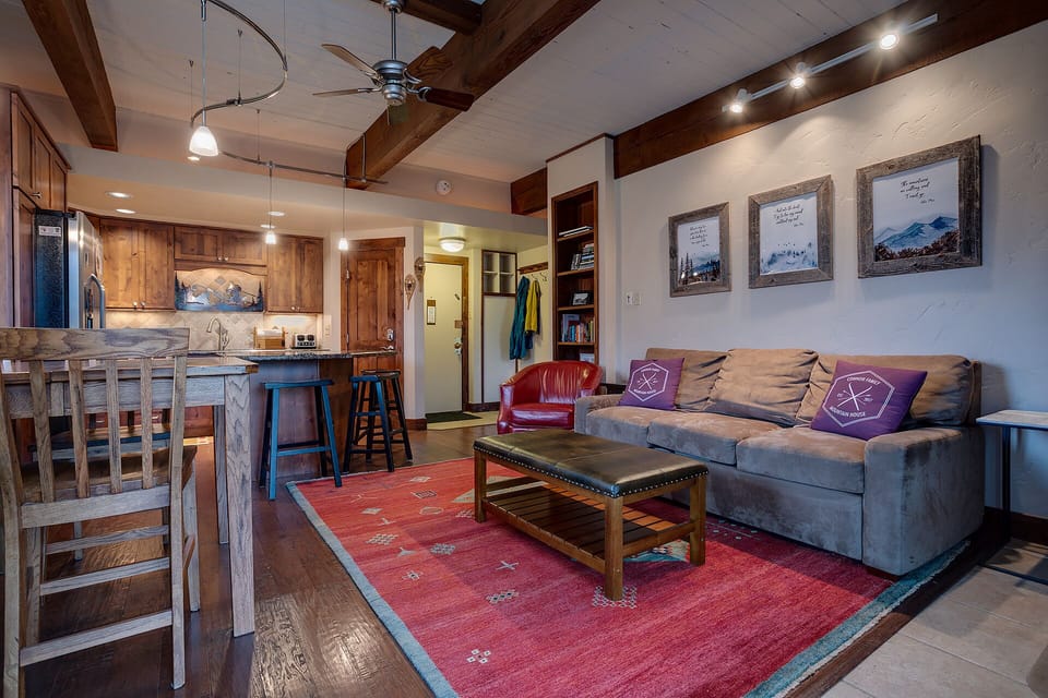 Relax in your spacious mountain retreat with exposed beams, cozy living area, and fully equipped kitchen for memorable alpine evenings.