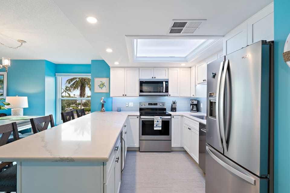 Updated beautiful kitchen with quartz countertops and stainless steel appliances