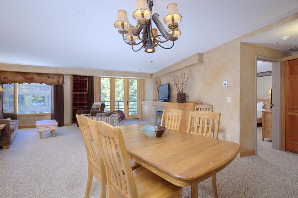 Dining table seats 6-extra chairs and leaf in condo