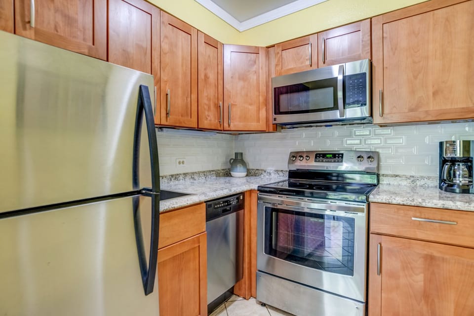 Remodeled cabinets, stainless steel appliances, granite countertops