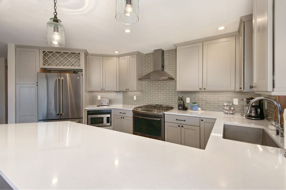 Full kitchen with stainless steel appliances.