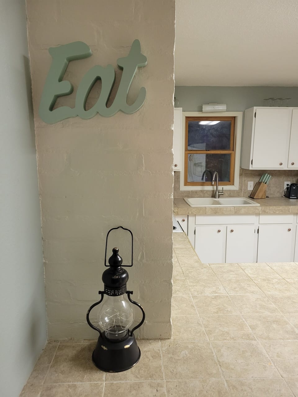 Eat-in kitchen with six stools. Many additional  small appliances.