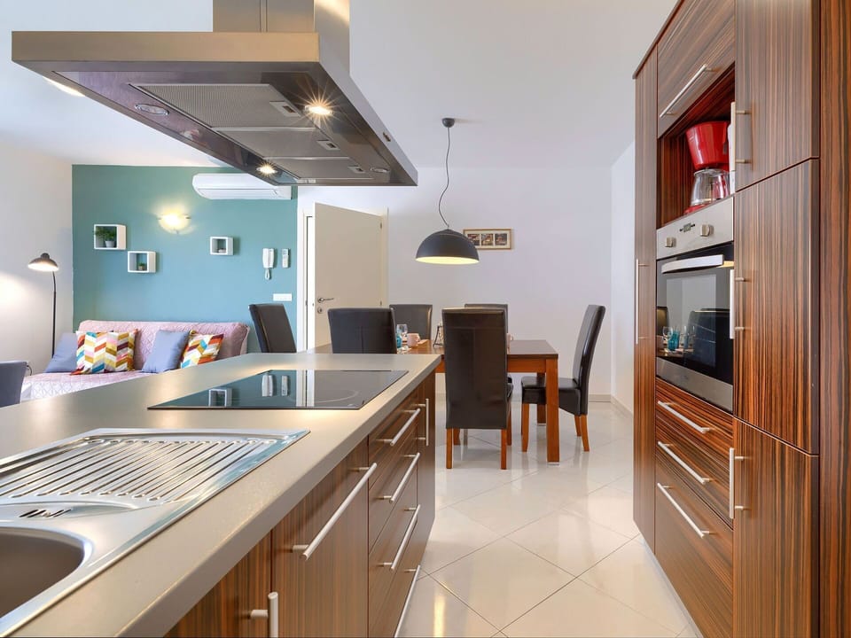 Cabinetry, Furniture, Countertop, Property, Drawer, Kitchen, Table, Wood, Kitchen Stove, Lighting