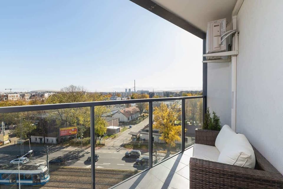 A balcony with comfortable furniture allows you to spend time outdoors.
