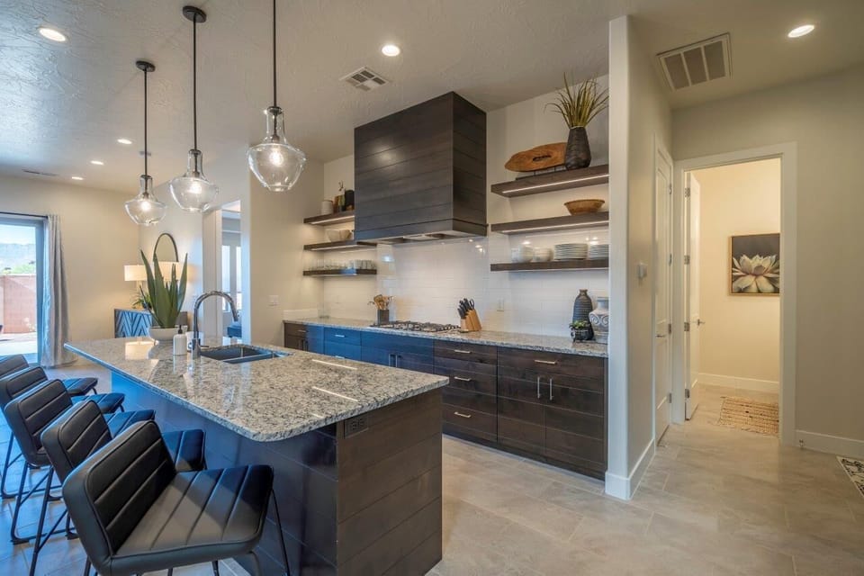 Kitchen is stocked with appliances and utensils for cooking