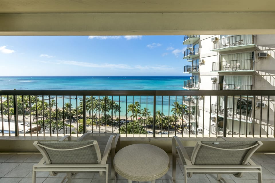 Breathtaking ocean views stretch endlessly before you from this private balcony, where palm-lined shores and turquoise waters create your perfect tropical escape.