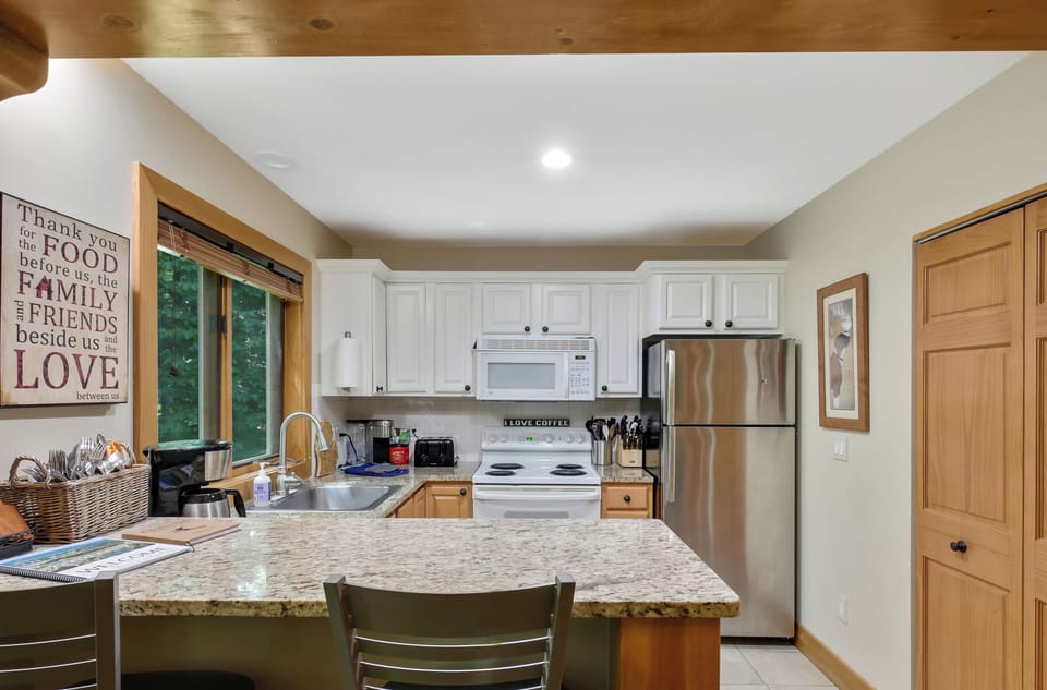 Full kitchen on main level stocked with lots of great extras to enjoy.
